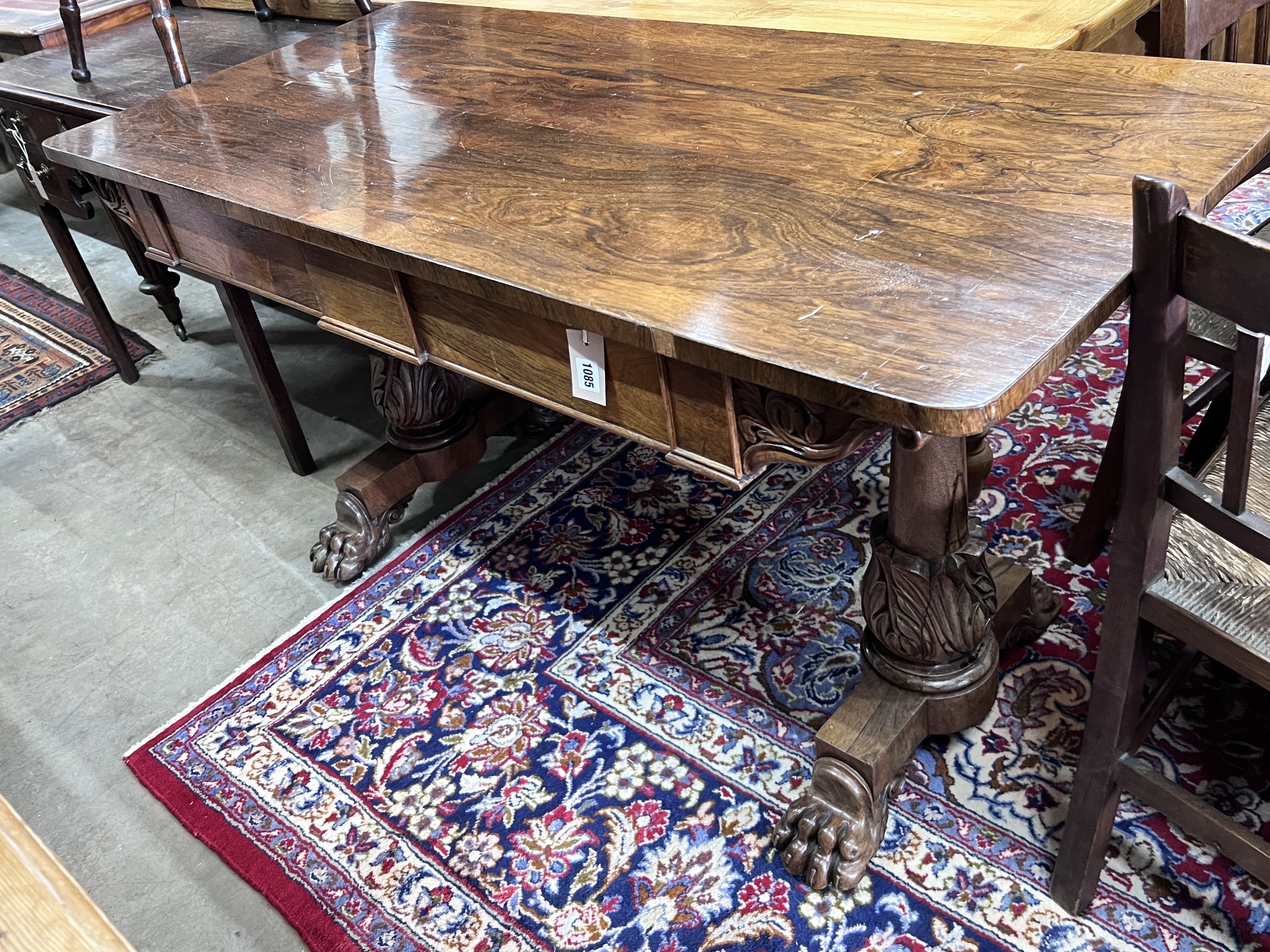 A Victorian rosewood two drawer library table, width 143cm, depth 68cm, height 77cm